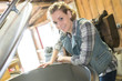 © auremar - happy woman checking fermentation compartment on factory