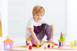 © Olesia Bilkei - cute kid playing with toy railway at home