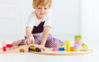 © Olesia Bilkei - cute kids playing with toy railway road at home. focus on train