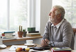 © Rawpixel.com - Senior Adult Looking Outside WIndow Relax Concept