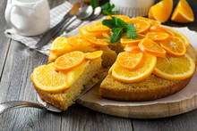 Orange And Mandarin Cake With Polenta, Upside Down On The Old Wooden Background. Selective Focus..