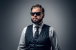 © Fxquadro - An elegant bearded business man in sunglasses.