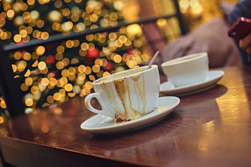 Two white cups with aroma refreshing coffee.