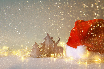 wooden christmas tree and deer with garland lights