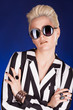 © DC Studio - Sexy rock girl wearing sunglasess in studio photo