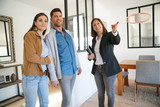 Fototapeta  - Couple with real-estate agent visiting house for sale