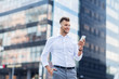 © Syda Productions - man with headphones and smartphone listening music