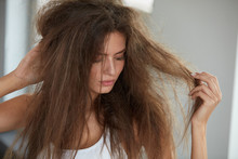 Woman With Holding Long Damaged Dry Hair. Hair Damage, Haircare.