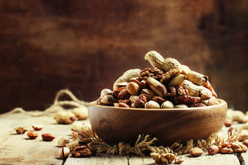 Wall Mural - Nuts mix, healthy and beneficial food, vintage wooden background