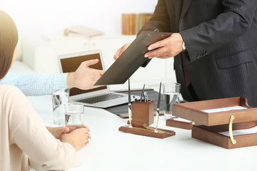 Wall Mural - Young couple with notary at office