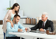 © Africa Studio - Young couple with notary at office