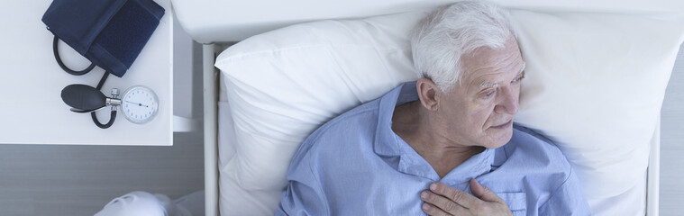 Canvas Print - Elderly man suffering from chest pain