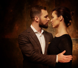 Wall Mural - Portrait of well-dressed couple in expression of feelings