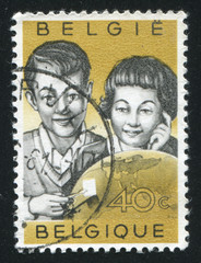 Sticker - Children Examining Stamp and Globe