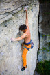 © zhukovvvlad - Male sports and climbs on the rock.