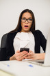 © romankosolapov - Closeup portrait young, shocked business woman, looking at cell phone seeing bad text message, email, isolated indoors office background. Negative emotions, facial expressions