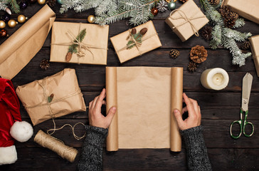 Man's hands holding a blank christmas paper