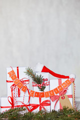 Wall Mural - Group Christmas white gift boxes with red ribbons and garland Merry Christmas.