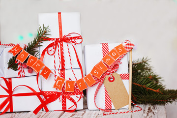 Wall Mural - Group Christmas white gift boxes with red ribbons and garland Merry Christmas.