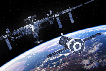 Wall Mural - spacecraft is preparing to dock with international space station