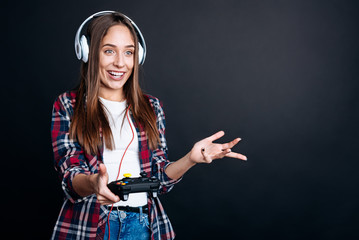 cheerful smiling girl playing video games