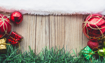 Santa Claus hat on Wooden with Balls and Gift Boxes with Green G