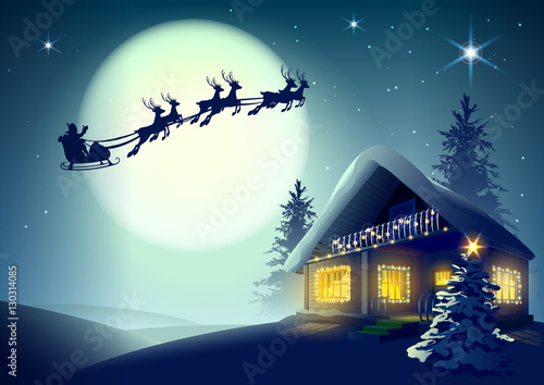 Fototapeta Silhouette Santa Claus and reindeer flying over Christmas house in winter forest