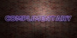 COMPLIMENTARY - fluorescent Neon tube Sign on brickwork - Front view - 3D rendered royalty free stock picture. Can be used for online banner ads and direct mailers..