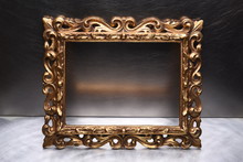 Antique Gold Wooden Frame On Grey Wall
