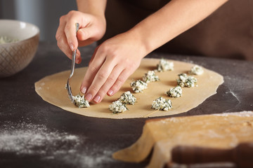 Wall Mural - Woman making ravioli on table