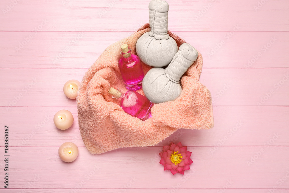 Spa still life with flower on pink wooden background