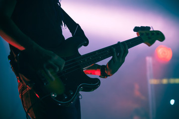 Wall Mural - Silhouette of bass guitar player on stage