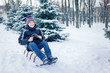 © 6okean - Young Man With Sled In Alpine Snow Scene