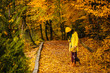 beautiful young woman walking outdoors in autumn
