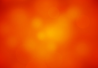 Wall Mural - abstract blur red orange colored background with shine light. blurry soft rubicund elegant wallpaper