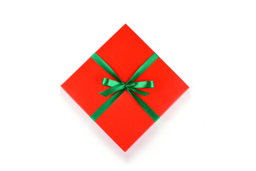 Wall Mural - Top view of red gift box with green ribbon and bow isolated on white background
