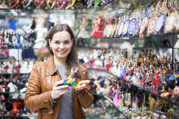 Wall Mural - Female customer in souvenir shop.