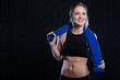 © Dewald - Beautiful female fitness model holding a towel/weights