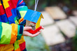 © Irina Schmidt - Little kid hanging bird house on tree for feeding in winter