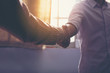 © boonchok - Business people shaking hands, finishing up a meeting