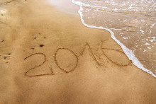 Year 2016 Drawing On The Sand Washed Away By The Wave