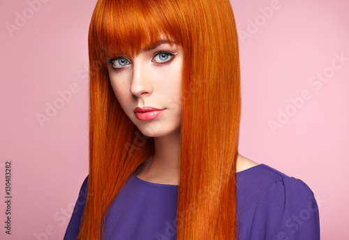 Portrait Of Beautiful Woman With Red Hair Colored Long