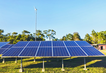 Wall Mural - solar energy panels and wind turbine ,clean energy background and blue sky