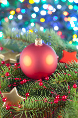 Sticker - Christmas ball on spruce branch and lighting background