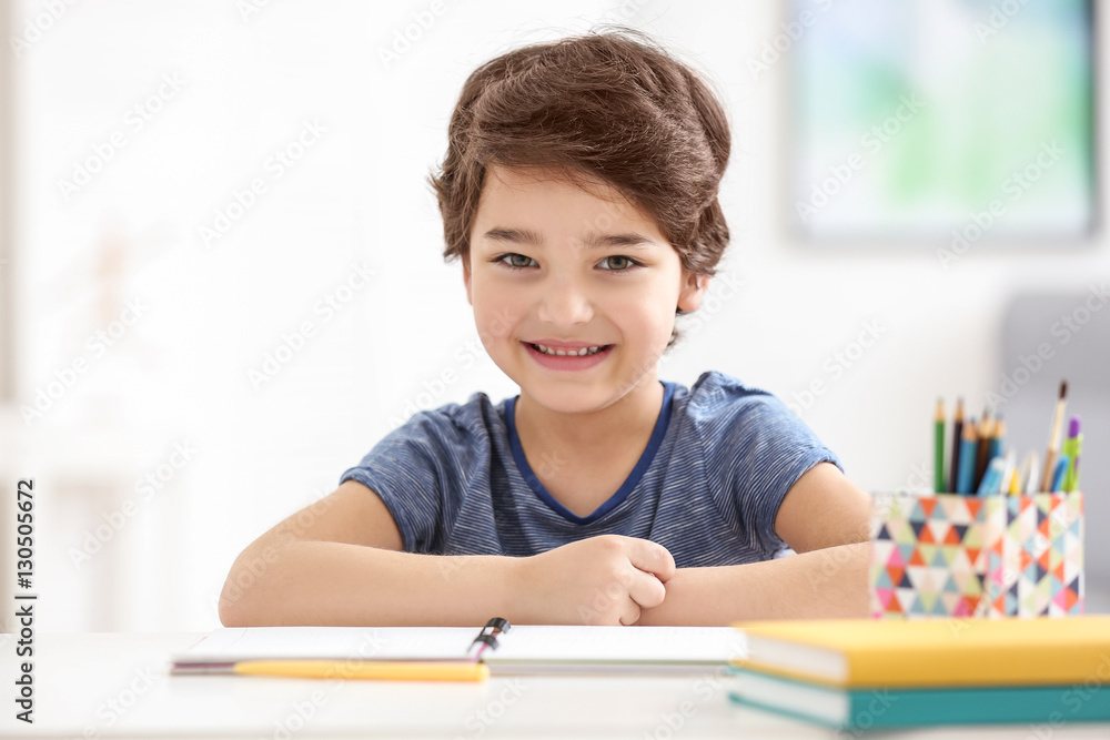 Cute little boy smiling, on blurred background