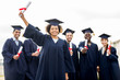 © Syda Productions - happy students in mortar boards with diplomas