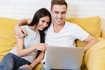 Wall Mural - Happy Coworkers sit on sofa in office