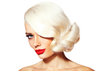 Portrait of young beautiful platinum blonde tanned woman with vintage hairdo and red lipstick over white background