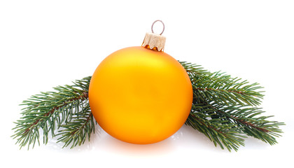 yellow decorations ball and fir branches isolated