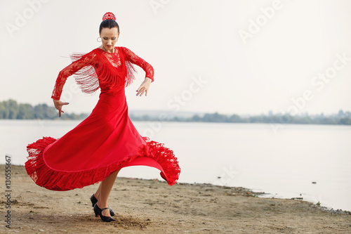 Photo  Flamenco dancer Spain womans in a long red dress